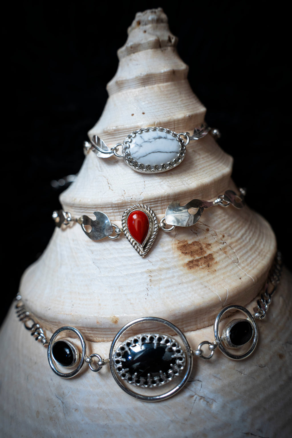 silver necklaces chokers on shell