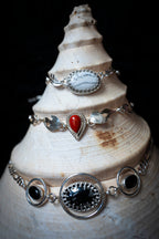 silver necklaces chokers on shell